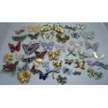 A collection of butterfly brooches