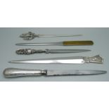 Five letter openers including a Dutch silver example, 1937, and advertising