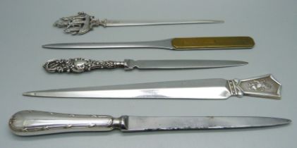Five letter openers including a Dutch silver example, 1937, and advertising