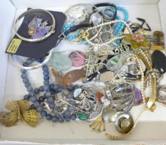 Silver bangles and brooches and other costume jewellery