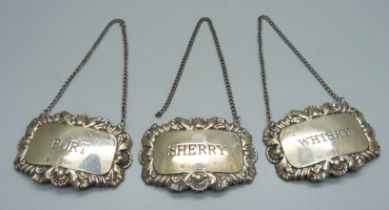 A set of three silver spirit labels, London 1968, D J Silver Repairs, sherry, whisky and port, 40g