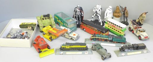 A collection of die-cast model vehicles and Star Wars figures