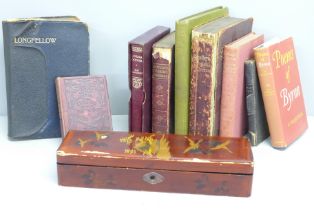 A collection of poetry books including Byron, Shelley and a pencil box
