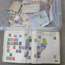 An album of stamps, loose stamps and a banknote