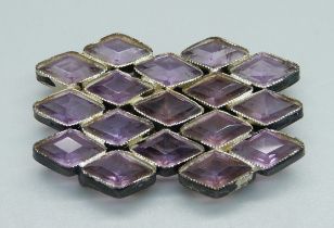 A white metal and amethyst coloured stone belt buckle, 35mm x 55mm