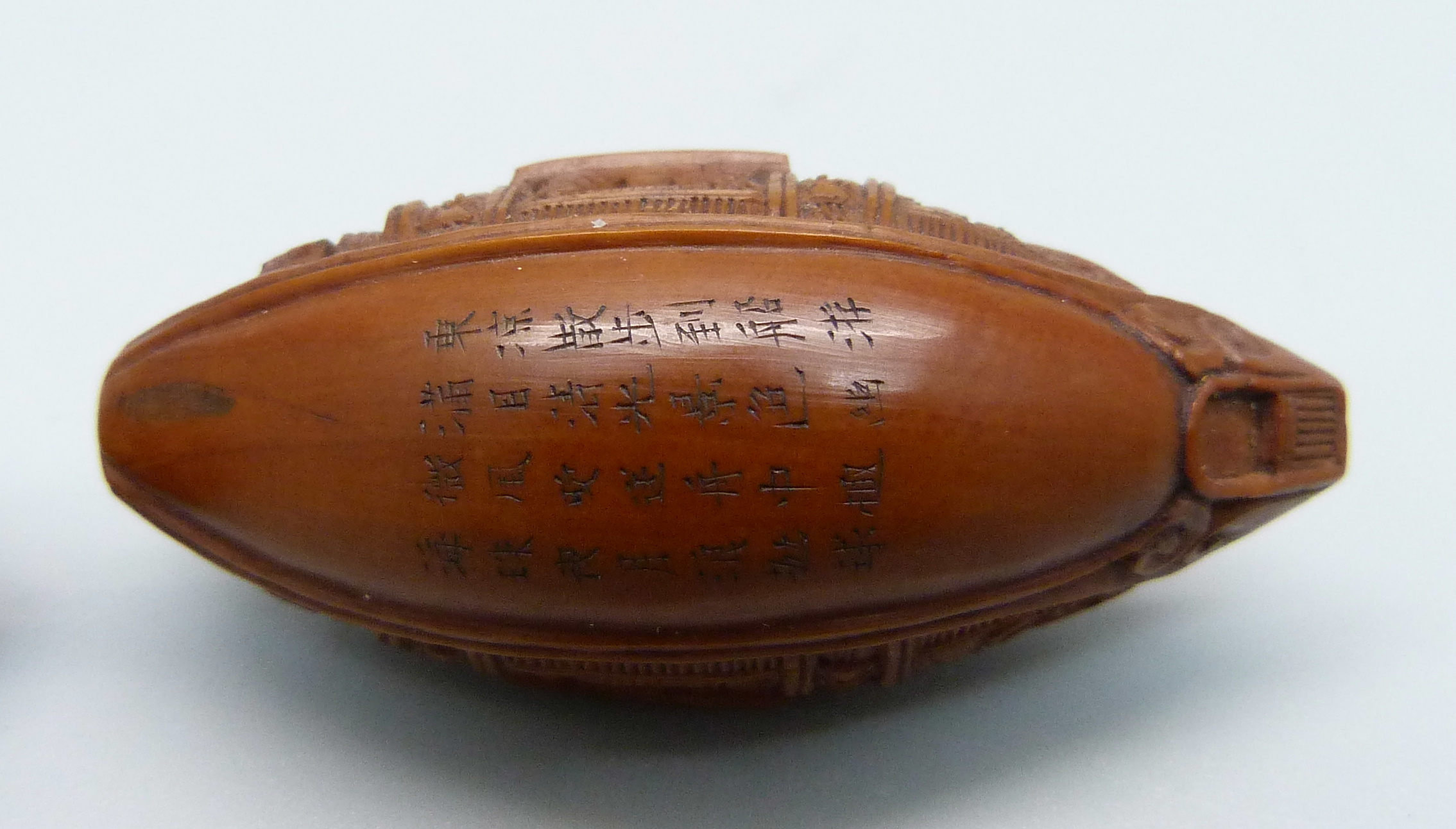 Two carved hediao nuts, one in the form of a Sampan boat with Chinese script - Image 4 of 4