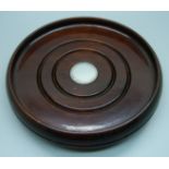 A wooden wine coaster with silver inlay, diameter 17cm