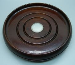 A wooden wine coaster with silver inlay, diameter 17cm