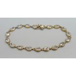 A silver gilt and crystal line bracelet, marked on end ring