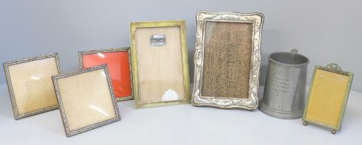 A pewter tankard dated 1955, a silver photograph frame, a/f and five other photograph frames