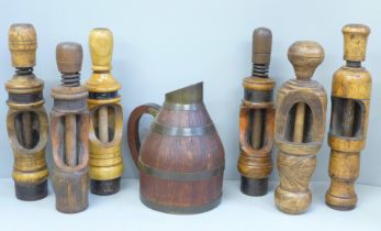 Six wine bottle corkers and a flagon