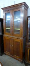 A Victorian pitch pine bookcase, with brushing slide