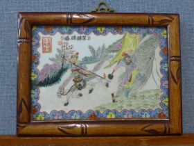 A Chinese painting on porcelain, two warriors, framed