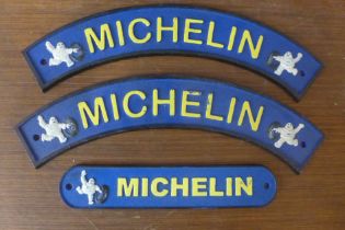 Three painted cast iron Michelin advertising signs