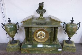 A brass and onyx clock garniture