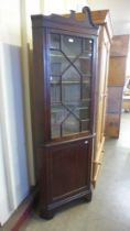 An Edward VII mahogany corner cabinet