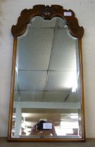 A walnut framed salon mirror