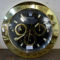 A Rolex style dealer's display wall clock