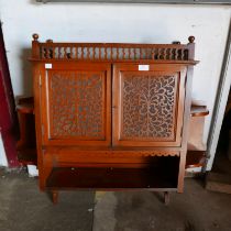 A victorian mahogany wall mounted two door cupboard