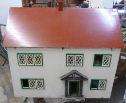 A painted wooden doll's house