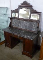 An Edward VII walnut and marble topped mirror back sideboard/desk