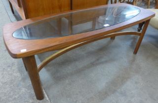 A Nathan teak and glass topped coffee table