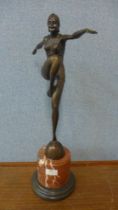 An Art Deco style bronze figure of a female dancer, on rouge marble socle