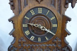 A late 19th Century carved oak cuckoo clock, a/f