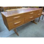 An Austin Suite teak six drawer sideboard