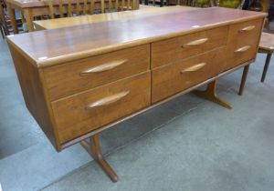 An Austin Suite teak six drawer sideboard