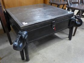 An African ebonised and iron mounted coffee table