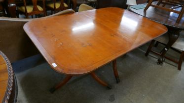 A yew wood pedestal dining table, a display cabinet and a corner cabinet