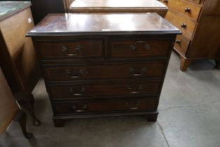 A small inlaid mahogany chest of drawers