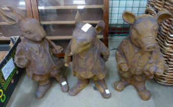 A set of three cast iron Beatrix Potter garden figures