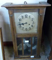 An oak wall clock