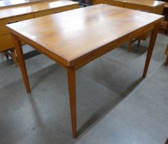 A teak draw leaf dining table