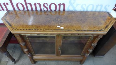 A Victorian Gothic Revival inlaid walnut, burr walnut and parcel gilt two door side cabinet,