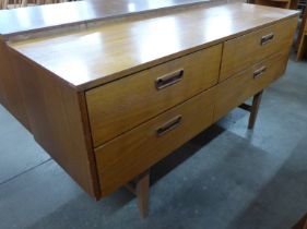 A teak four drawer sideboard