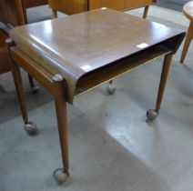 A Danish teak and tola wood occasional table