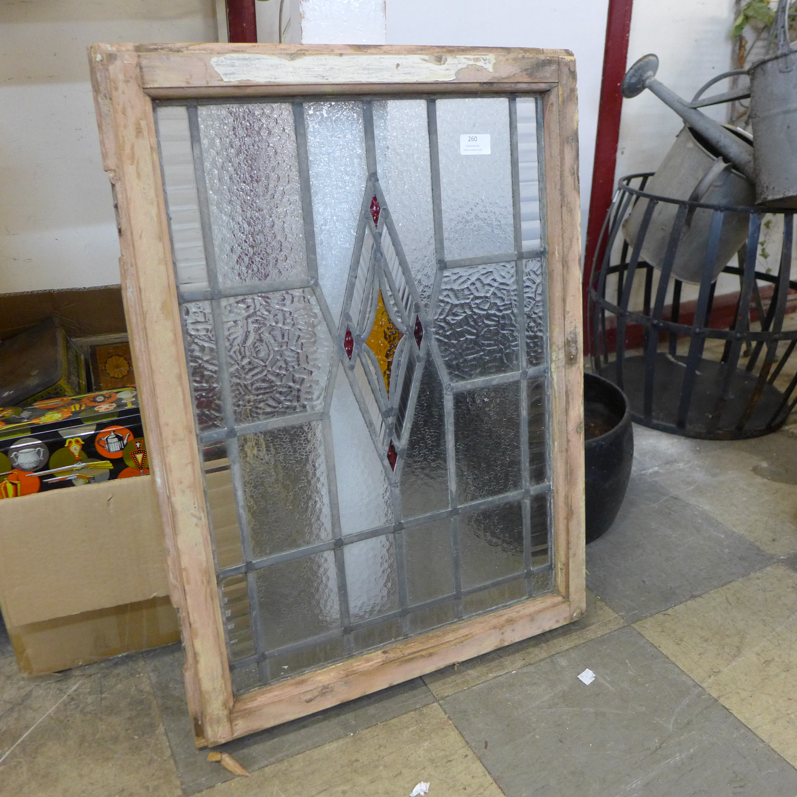 A framed Art Deco stained glass window