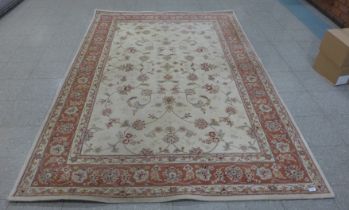 A Chinese cream ground part silk rug, 273 x 183cms