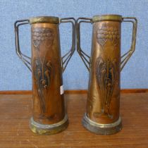 A pair of Arts and Crafts copper and brass two handled vases