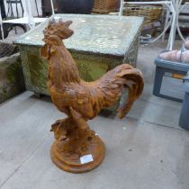 A cast iron garden figure of a cockerel