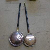 Two copper warming pans