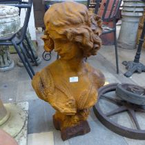 An Art Nouveau style cast iron garden bust of a lady