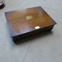 An oak cased E.P.N.S canteen of cutlery with faux ivory handles