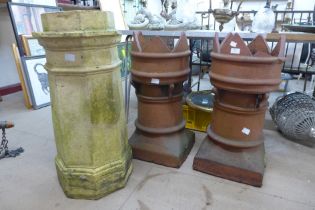 A pair of Victorian terracotta crown top chimney-pots, a/f, and one other