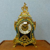 A French Boulle style gilt metal and simulated inlaid mantel clock