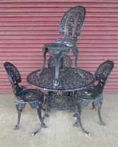 A painted cast alloy garden table and four chairs
