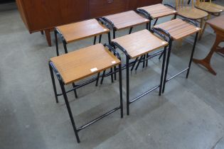 A set of six teak and and black tubular steel stools